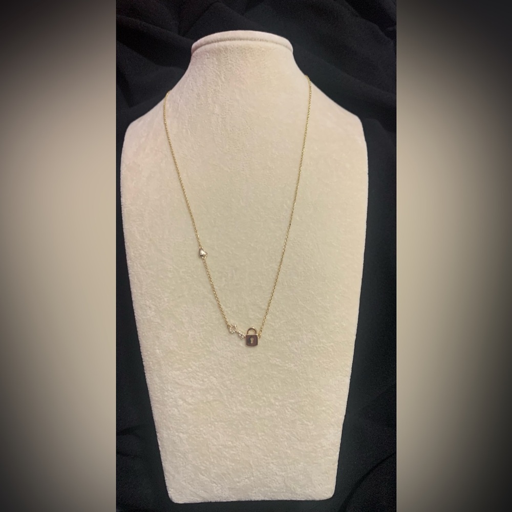 NWOT. Gold Necklace with Lock and Key Charm.